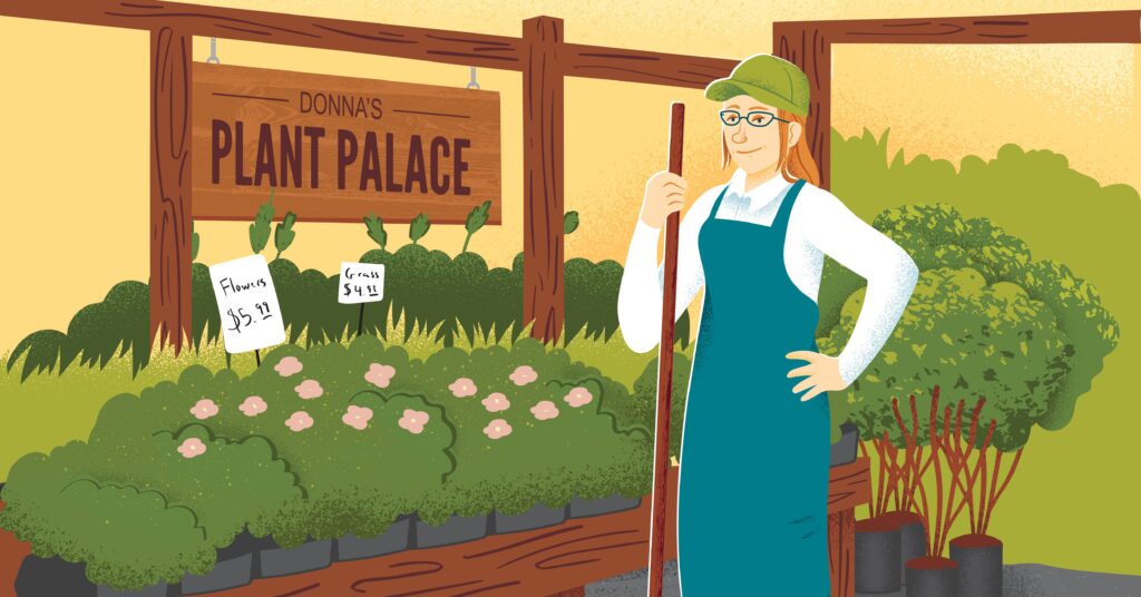 Woman wearing an apron standing in a plant nursery.